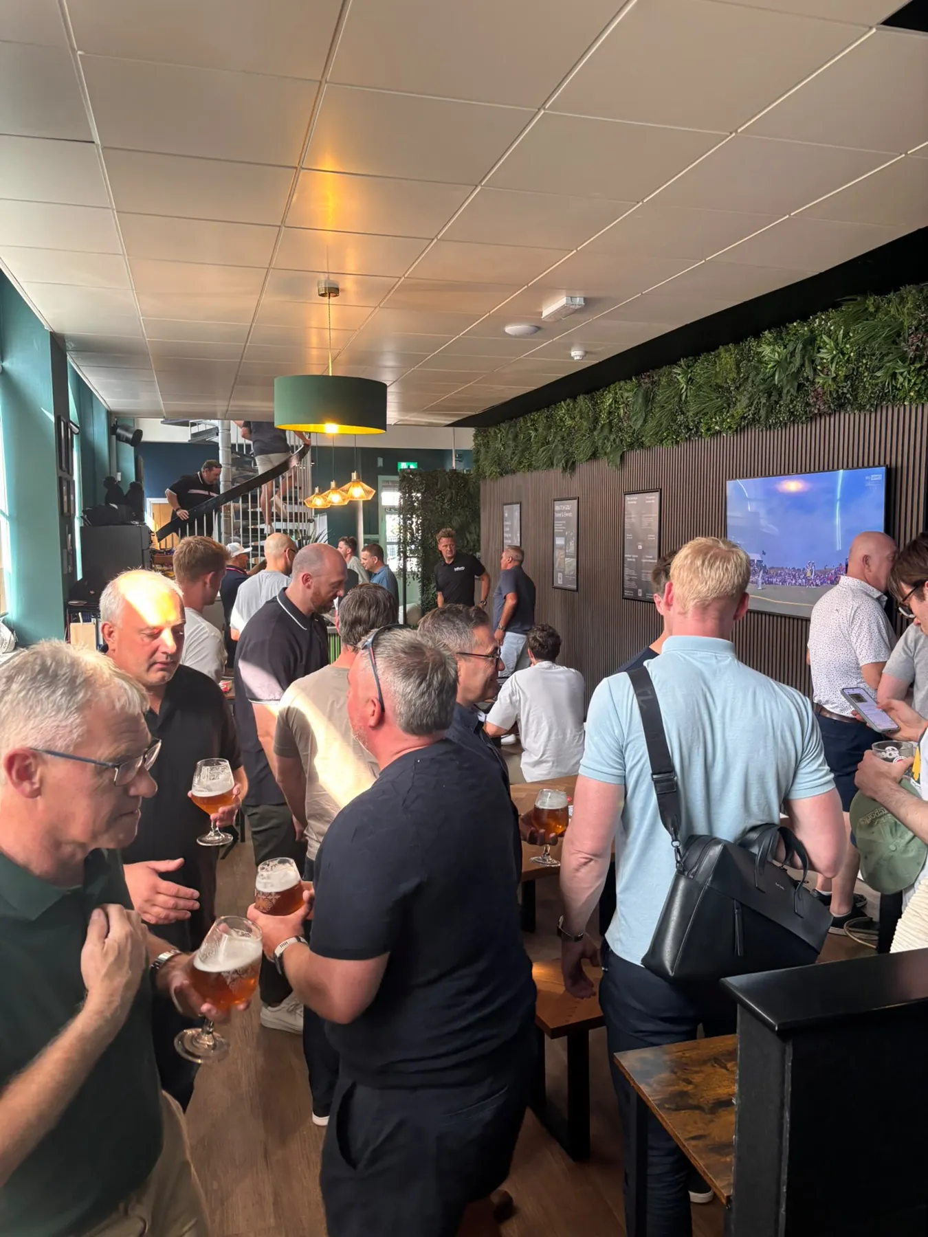 A busy SKRATCH event, guests with drinks filling the venue